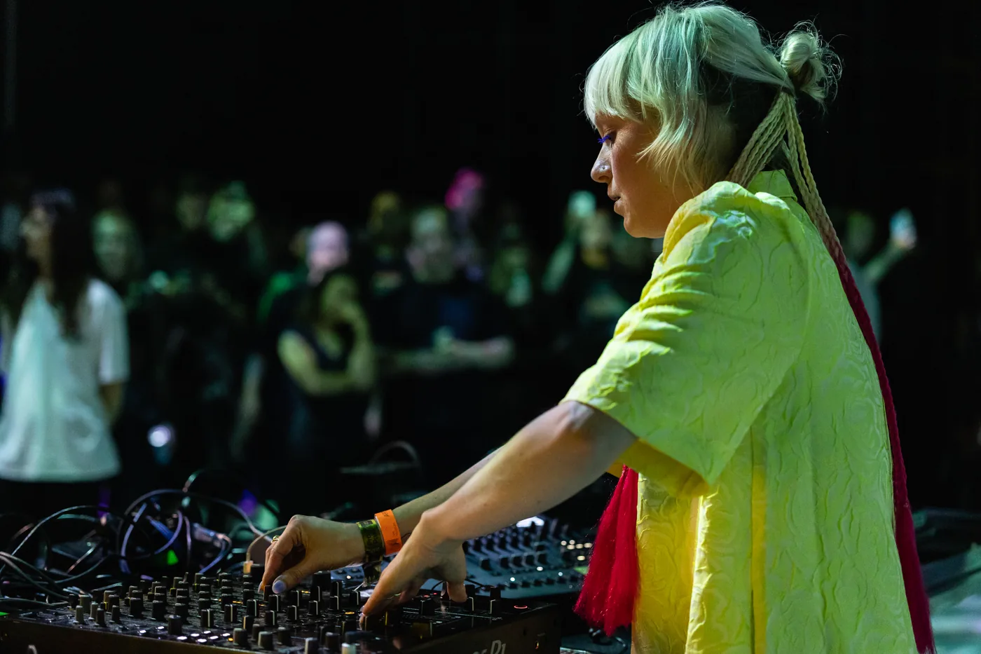 Nadia working with her live hardware, surrounded by the Nxt Museum audience