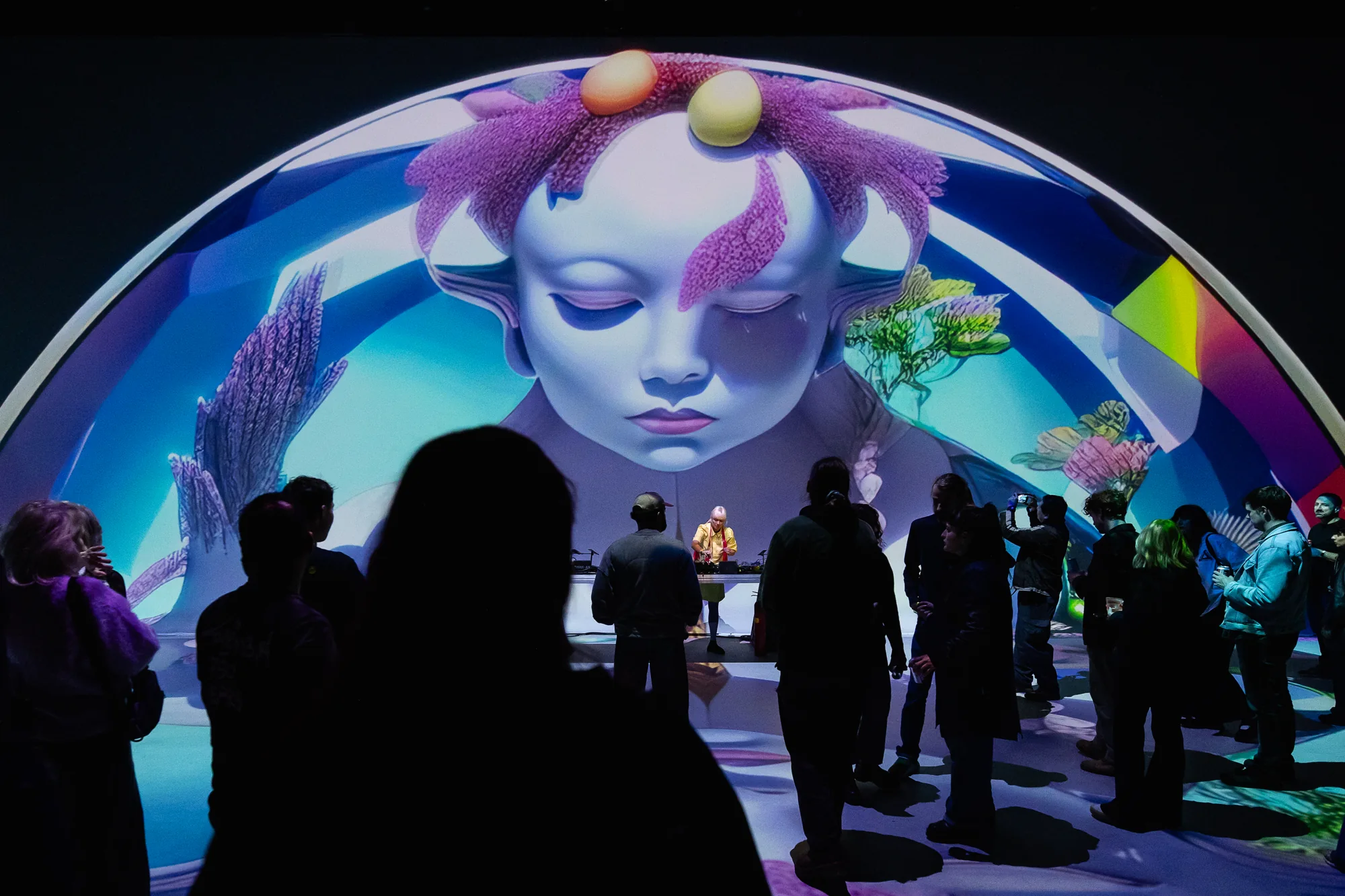 An immersive world of colour surrounds Nadia and the audience at Nxt Museum